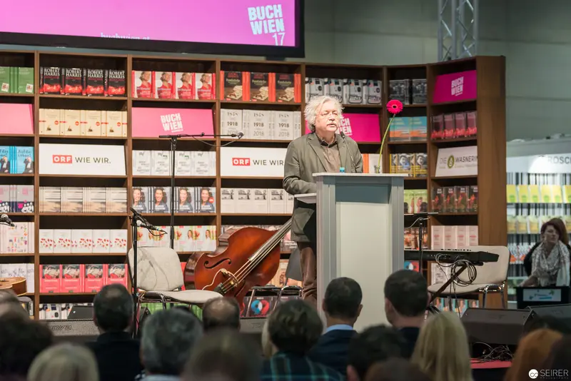 Author Reading at Buch Wien 2017 Literary Festival amid Book Display
