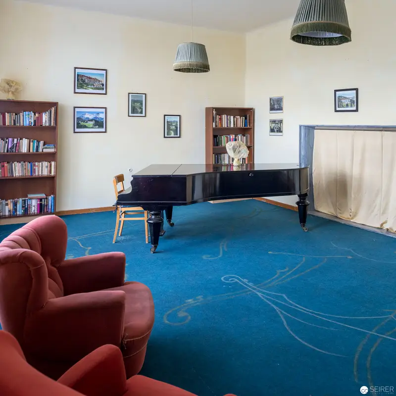 Contemplative Music Room with Grand Piano and Blue Carpet Landscape