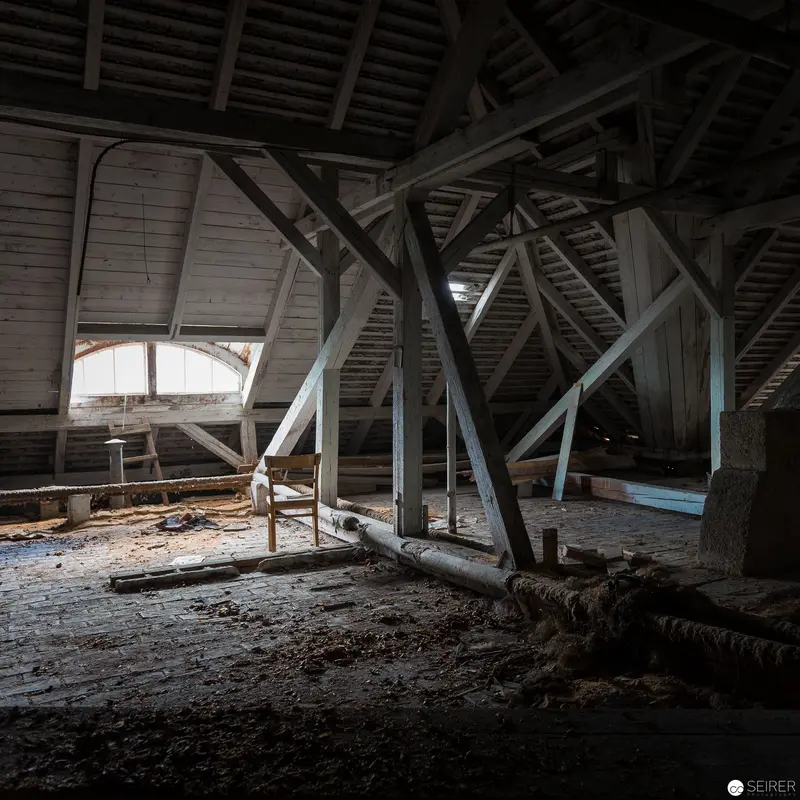 Abandoned Attic Interior: Architectural Decay and Structural Timber Framing