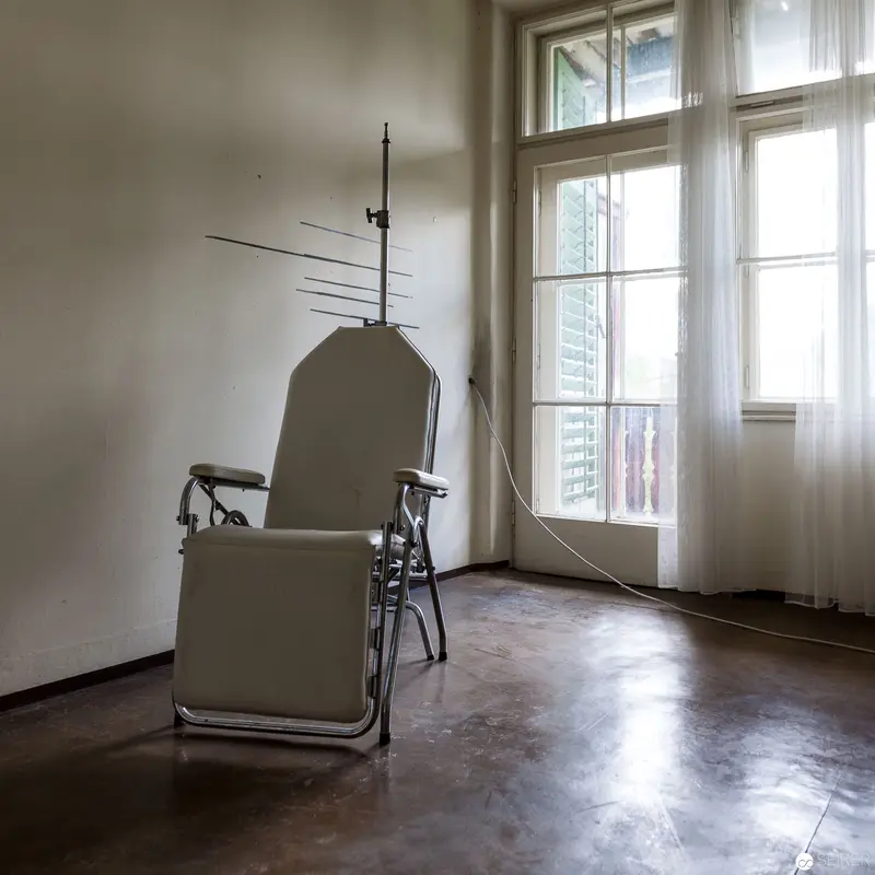 Minimalist Interior with Vintage Medical Chair near Curtained Window