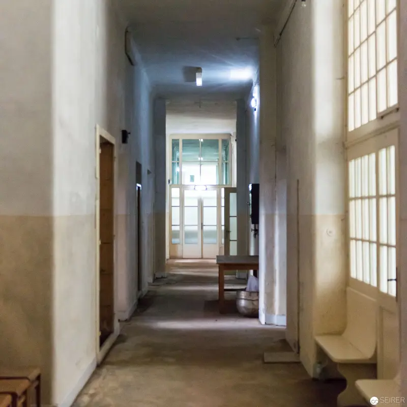Institutional Corridor with Diffused Light and Architectural Geometry