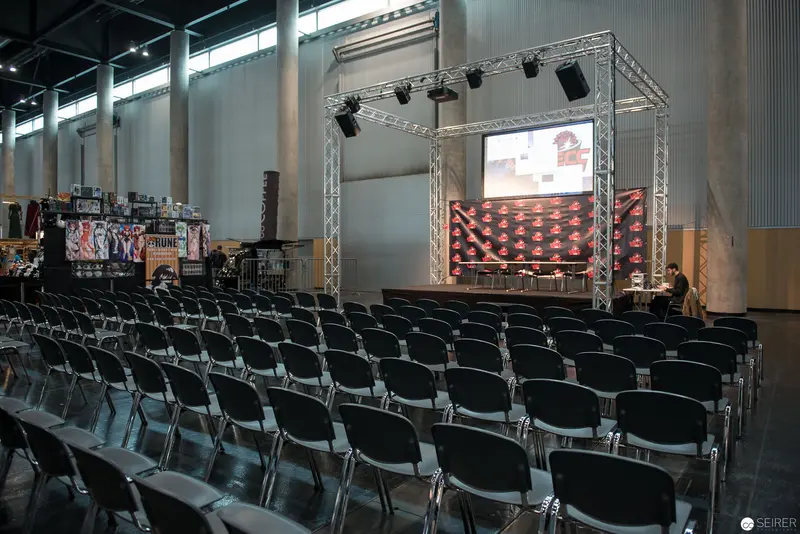 Empty Conference Hall with Multimedia Stage Setup and Technical Lighting Rig