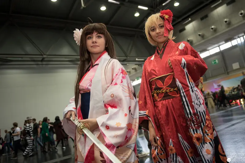 Cosplay Performance at Convention Featuring Two Japanese-Styled Costume Performers