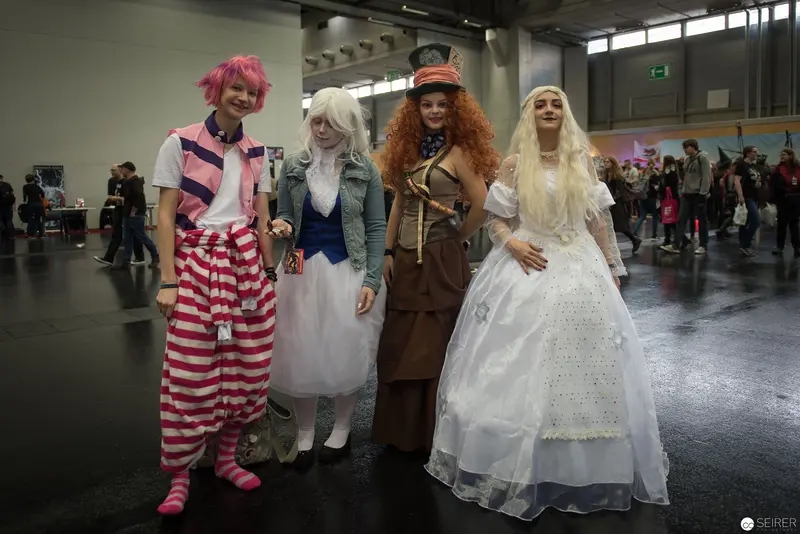 Cosplay Performers in Diverse Character Costumes at Convention Hall