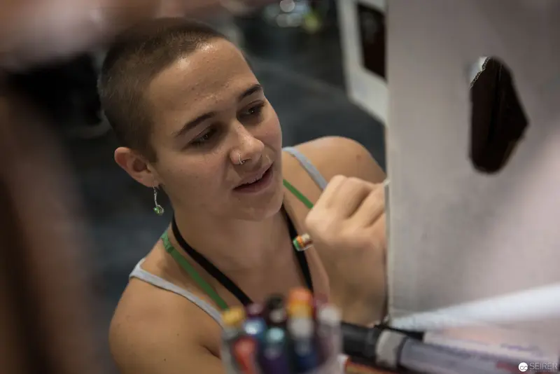 Studio Artist Creating Detailed Work with Concentrated Gesture and Tattoo Ink