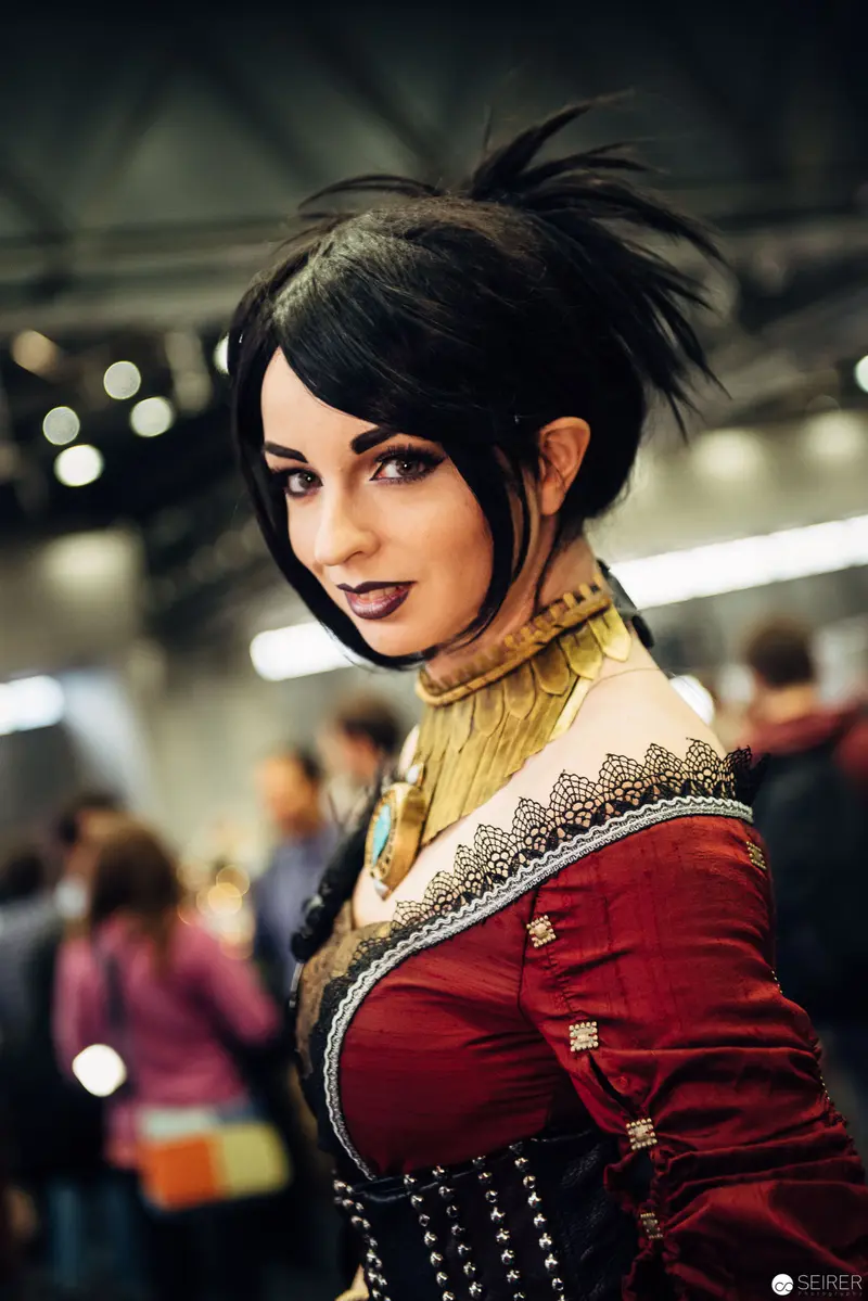 Cosplay Portrait of Woman in Steampunk-Inspired Red Costume at Convention