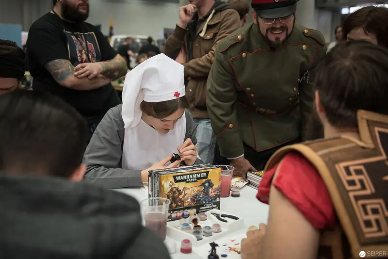 Warhammer Miniature Painting Workshop with Costumed Participants at Gaming Convention
