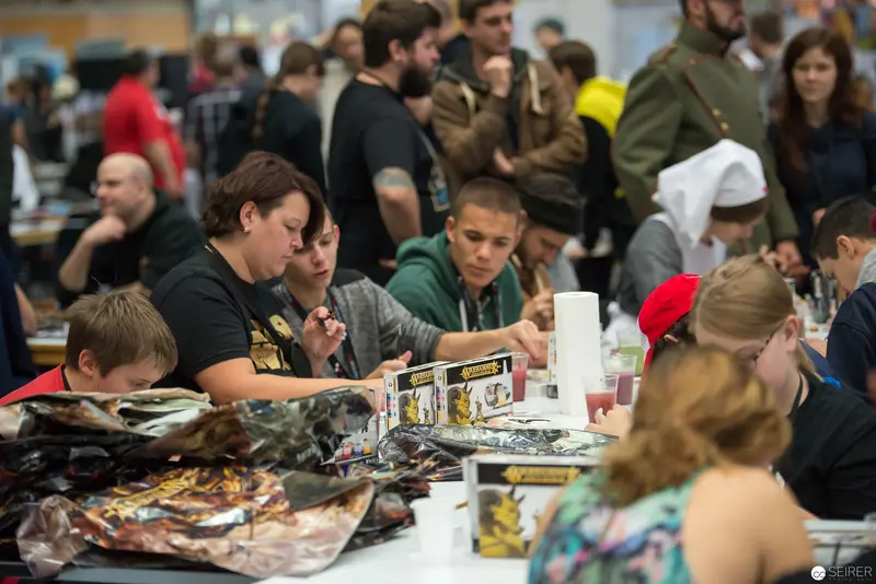 Community Gaming Event: Tabletop Players Engaged in Collective Strategic Interaction