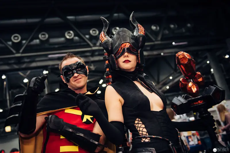 Comic Convention Cosplayers in Dramatic Superhero and Villain Postures