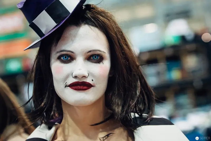 White-Faced Performer in Top Hat with Theatrical Mime-Inspired Makeup