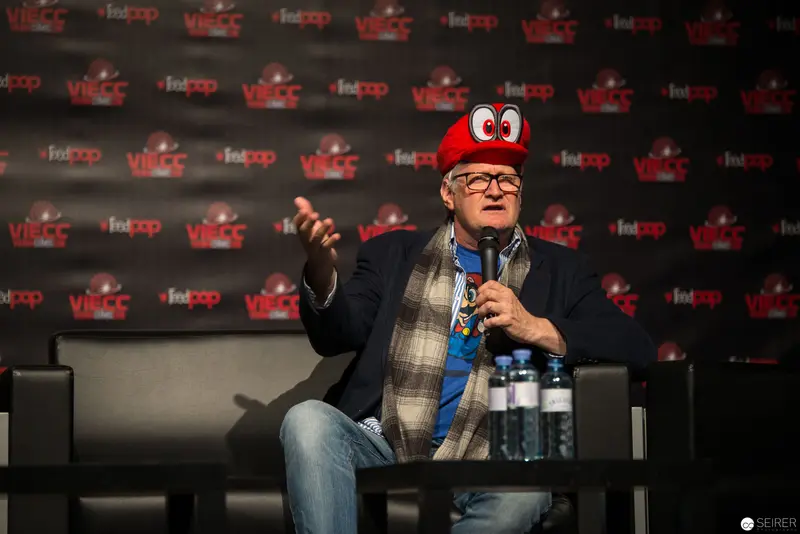Entertainment Executive in Red Cap Speaks at VRCC Media Conference