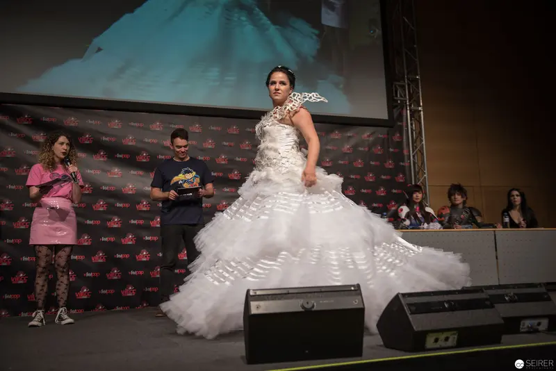 Fashion Runway Model in Elaborate White Multilayered Wedding Gown