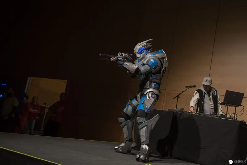 Robotic Performance Figure in Metallic Blue and Gray Armor with Weapon Stance