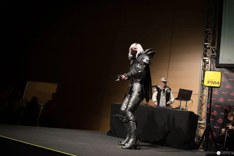 Cosplay Performance on Stage at FM4 Event with Dramatic Sci-Fi Costume