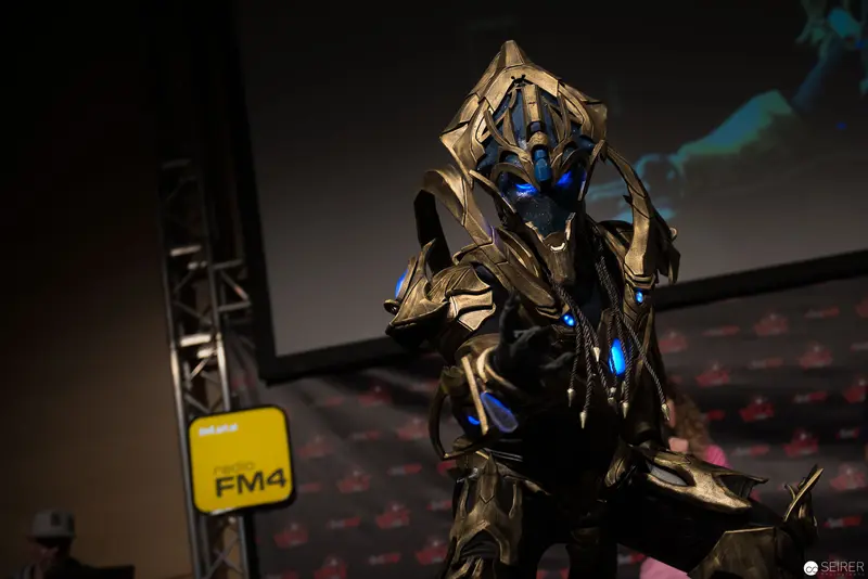 Metallic Robotic Figure with Blue Illumination at FM4 Event Stage