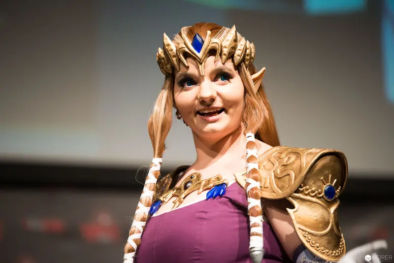 Cosplayer in Zelda Princess Costume with Intricate Golden Crown and Armor