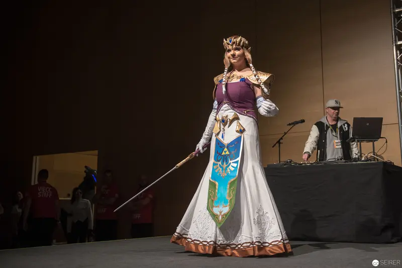 Cosplay Performance of Princess Zelda on Convention Stage with DJ