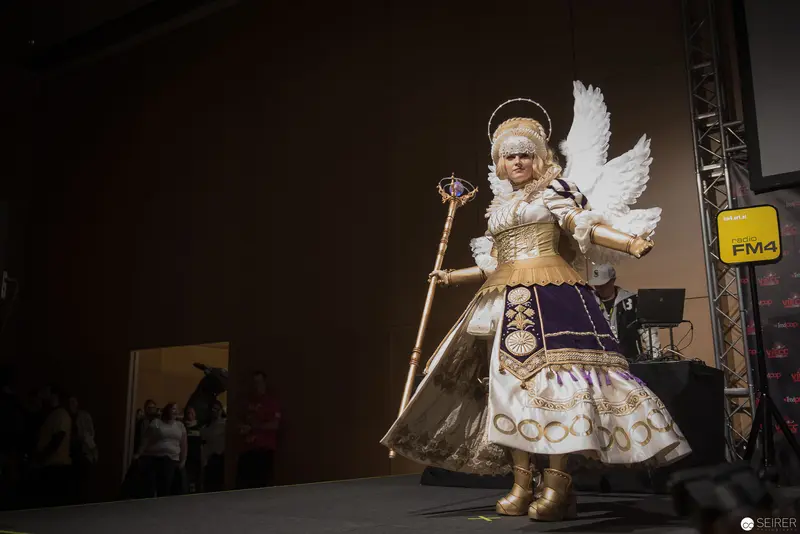 Costumed Performance of Winged Angel with Elaborate Baroque Styling on Stage