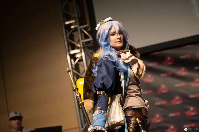 Anime Cosplay Performance on Stage with Intricate Character Costume