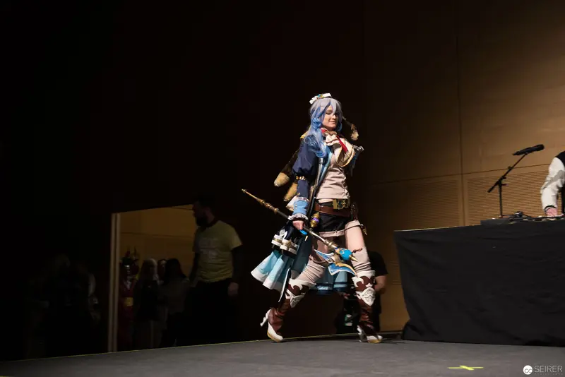 Cosplay Performance on Stage with Character in Elaborate Fantasy Costume