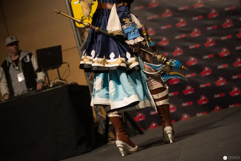 Cosplay Performance on Stage at Gaming Convention Showcasing Detailed Fantasy Costume