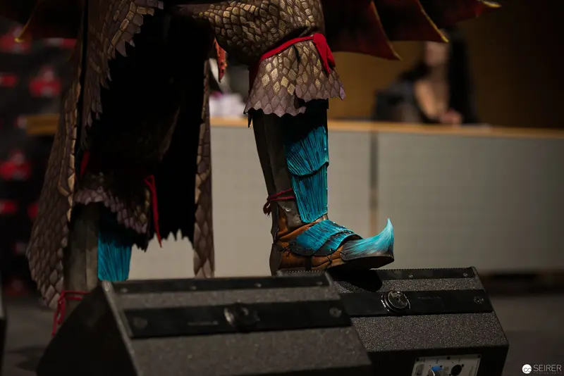 Detailed Dragon-Scale Costume Boot on Performance Stage Platform