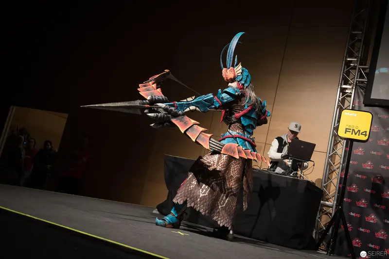 Costumed Performer in Dynamic Pose at FM4 Stage Event