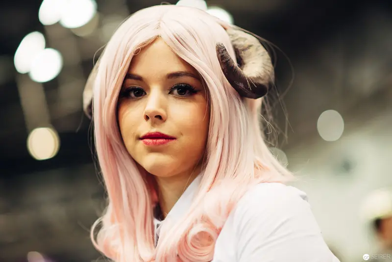 Young Woman with Pastel Pink Hair in Soft Focus Cosplay Portrait