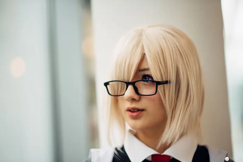 Blonde Cosplay Subject in Black-Rimmed Glasses and School Uniform