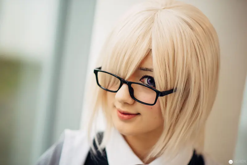 Blonde Cosplay Portrait with Black-Framed Glasses and Pale Background