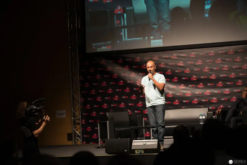 Performer Presenting on Stage at Entertainment Industry Conference