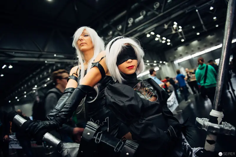 Two Cosplayers in White Wigs at Convention, Dystopian Science Fiction Styling
