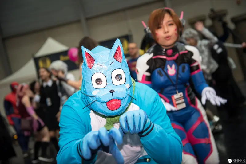 Blue Cartoon Cat Cosplayer at Anime Convention Poses Dramatically
