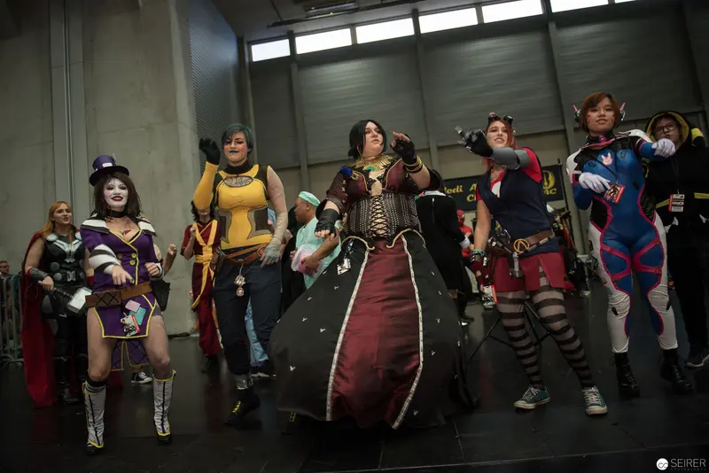 Cosplay Ensemble Posing at Convention Showcasing Diverse Character Costumes