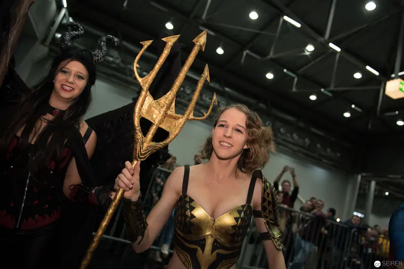 Cosplay Performance with Golden Trident at Fan Convention