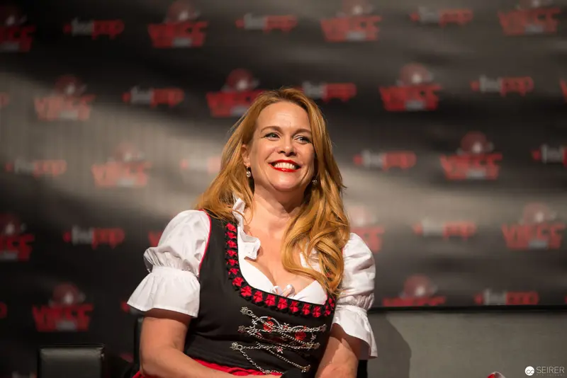Woman in Traditional Bavarian Dirndl at Press Event Smiling Warmly