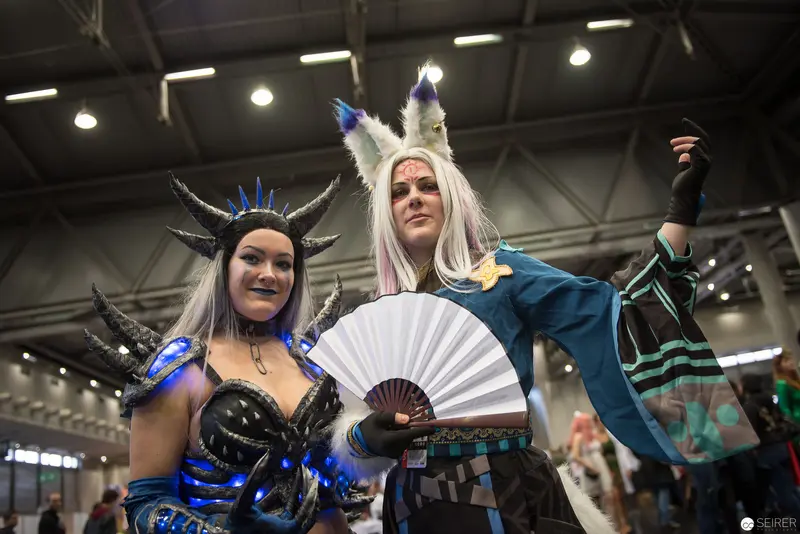 Cosplay Performers in Elaborate Fantasy Costumes at Convention Event
