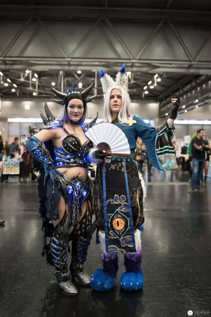 Cosplay Artists in Elaborate Fantasy Warrior Costumes at Convention
