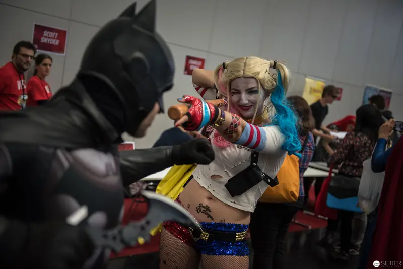 Comic Con Cosplay: Batman and Harley Quinn in Dramatic Confrontation