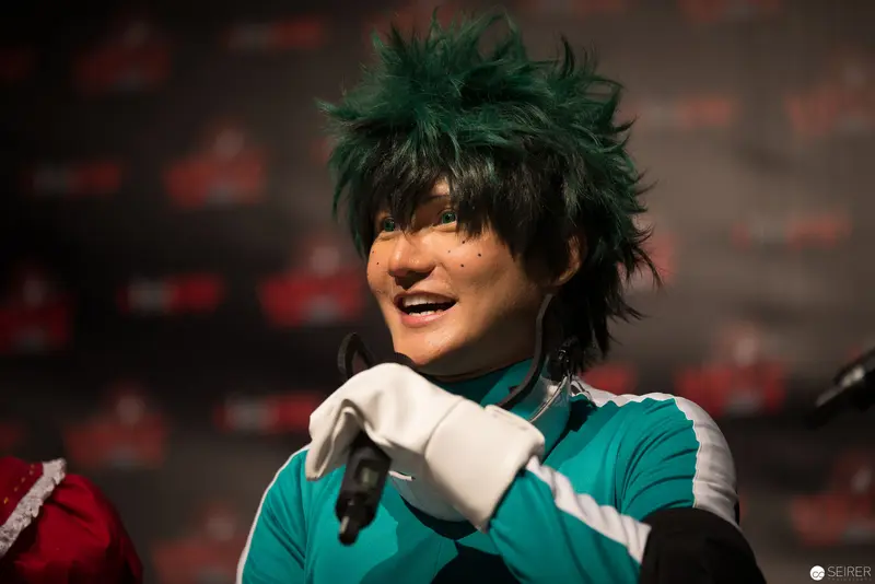 Cosplayer in Green Wig Portraying Animated Character at Performance Event