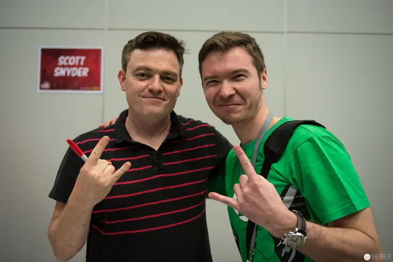 Two Men Pose with Rock Gesture at Scott Snyder Event