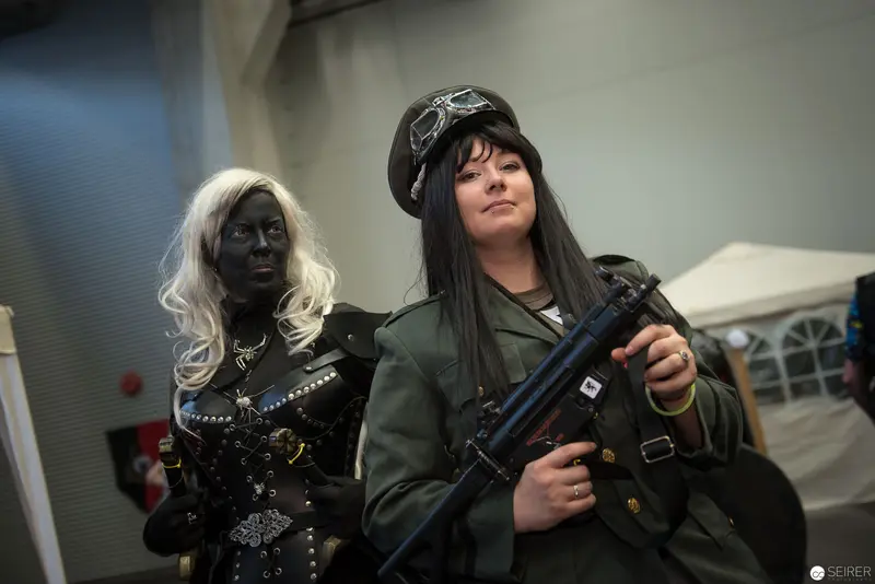 Two Costumed Performers with Contrasting Styles at Cosplay or Performance Event