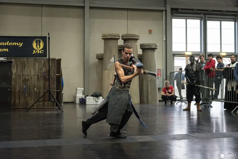 Klingenspiel Performer Demonstrating Historic Fencing Technique in Indoor Arena