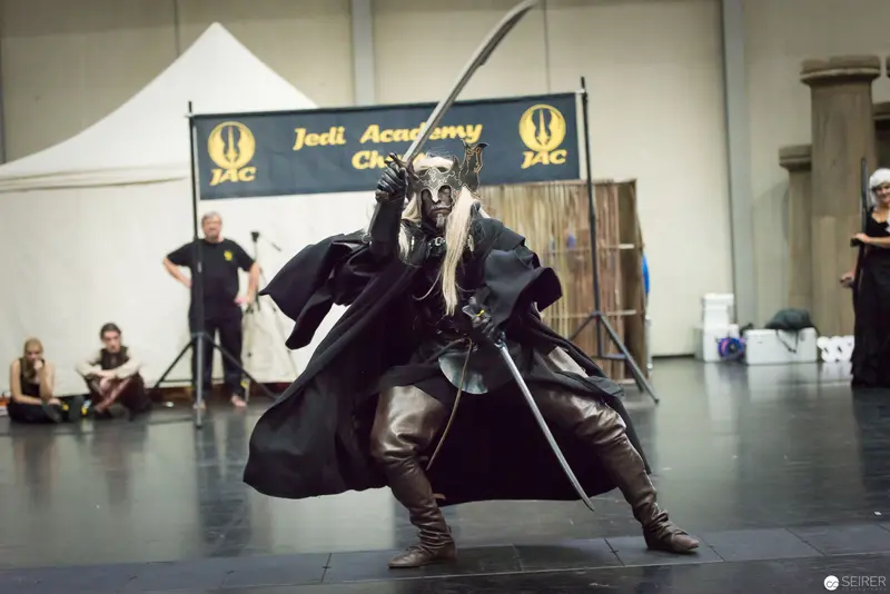 Jedi Academy Performer in Dynamic Lightsaber Combat Stance