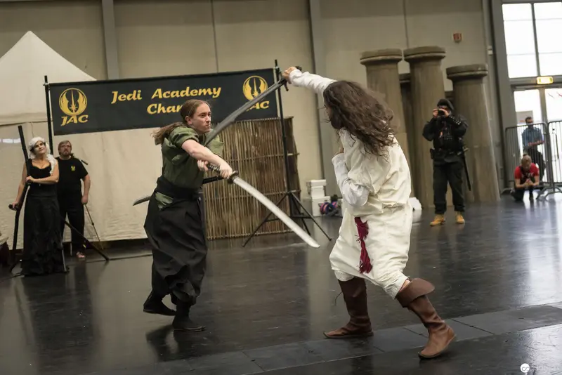 Jedi Academy Choreographed Lightsaber Duel with Performers in Stylized Costumes