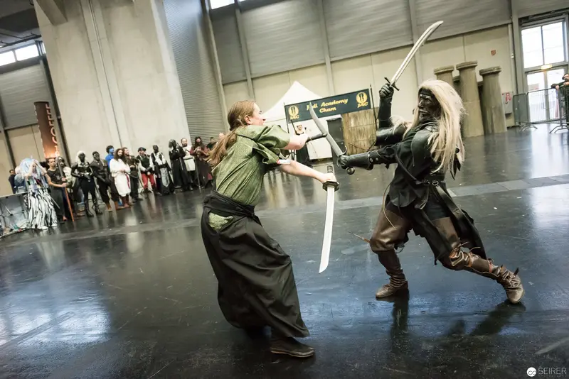 Klingenspiel Historic Fencing Performance: Duelists in Dramatic Sword Combat Stance