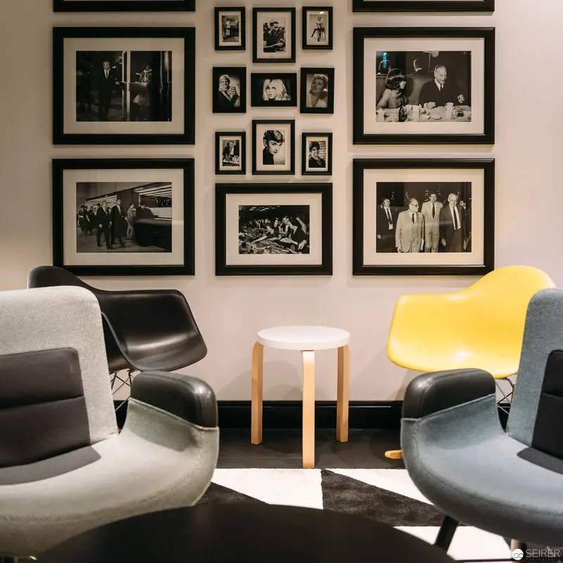 Mid-Century Modern Design Salon with Black and White Photographic Gallery Wall
