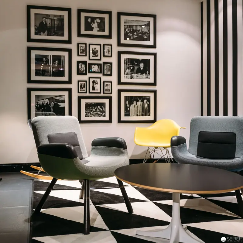 Mid-Century Modern Seating Area with Black and White Gallery Wall