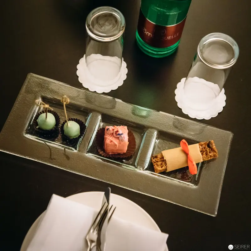 Fine Dining Artistry: Miniature Culinary Presentation at Luxury Hotel Bar