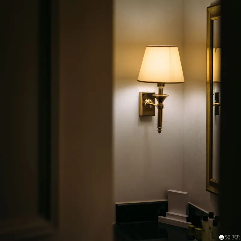 Soft-Lit Wall Sconce in Intimate Hotel Interior at Intercontinental